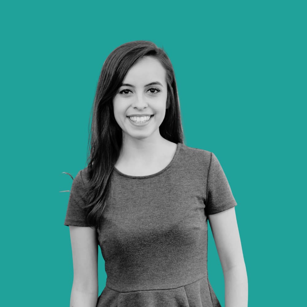 SMB Marketing agency team member Alondra in black and white with a green background.