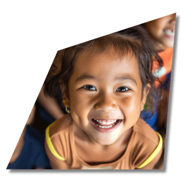 A girl smiling. Image to reflect a nonprofit marketing agency.