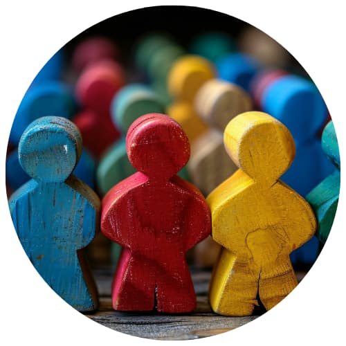 Diverse wooden figures symbolizing the local businesses our marketing packages are built to support.
