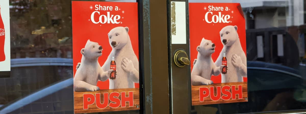 Coca-Cola advertisement with polar bears demonstrates branding and localization importance in multilingual content marketing.